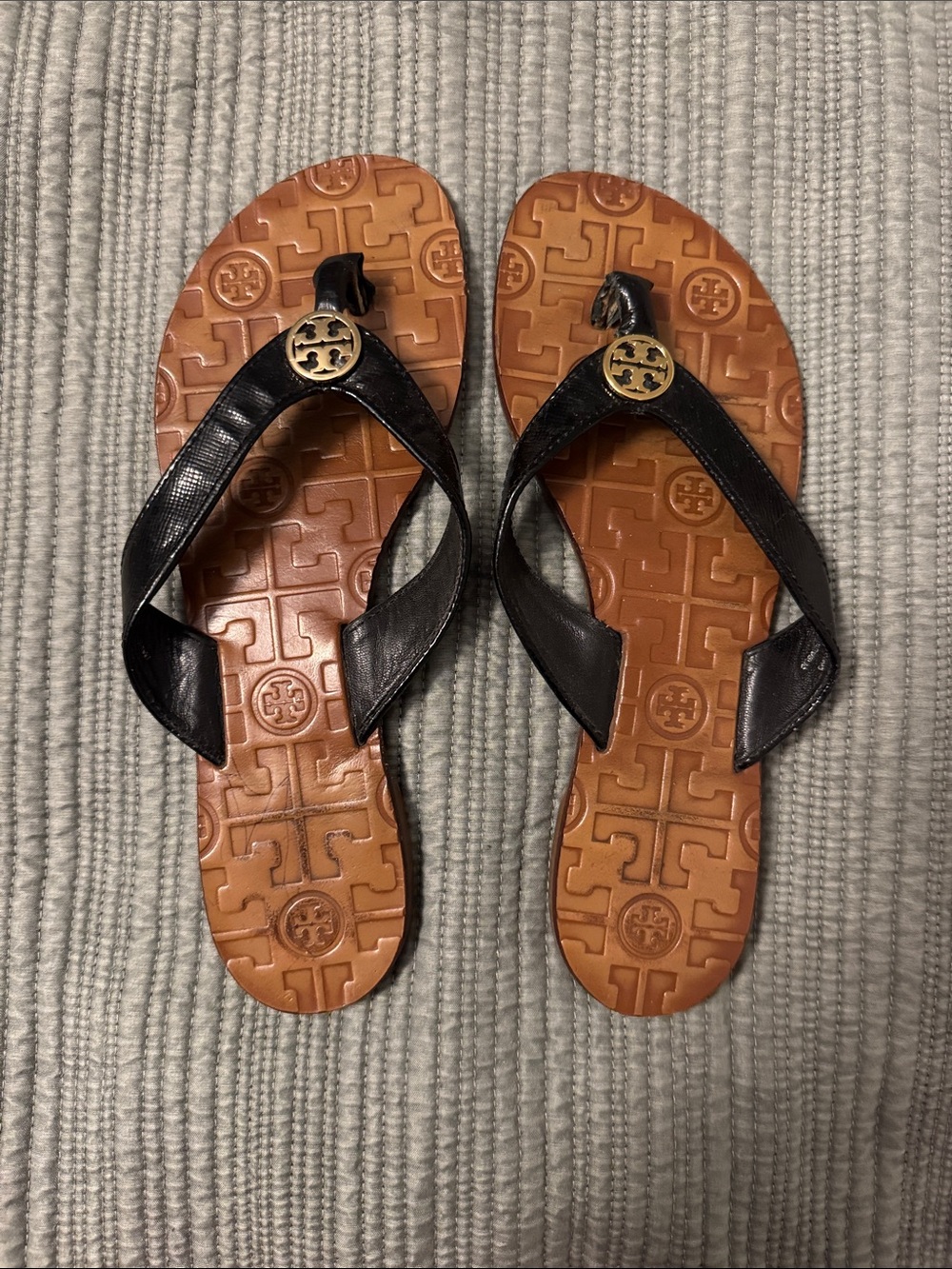 Tory Burch Black Leather Flip Sandals with Gold Logo Medallion
